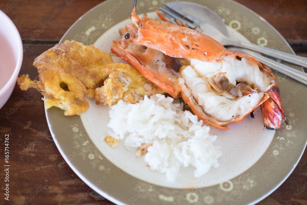 Thai Jasmine rice eating with shrimp and omelet Thai Jasmine rice eating with shrimp and omelet