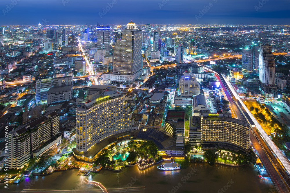 Bangkok aerial view skyline at night in location business and travel district. Bangkok aerial view skyline at night in location business and travel district.