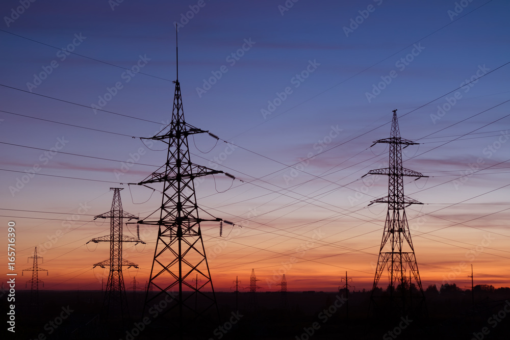 High voltage electricity pylons, sunset