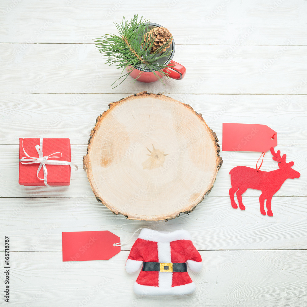 Blank wooden board for your copy, Santa toy costume with price tag, gift  box, mug with fir decor, deer toy with price tag on white wooden  background. Flat lay. Stock Photo |