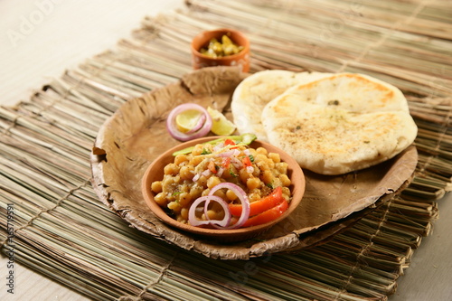 Matar kulcha or Dried yellow peas chaat with pan cooked bread