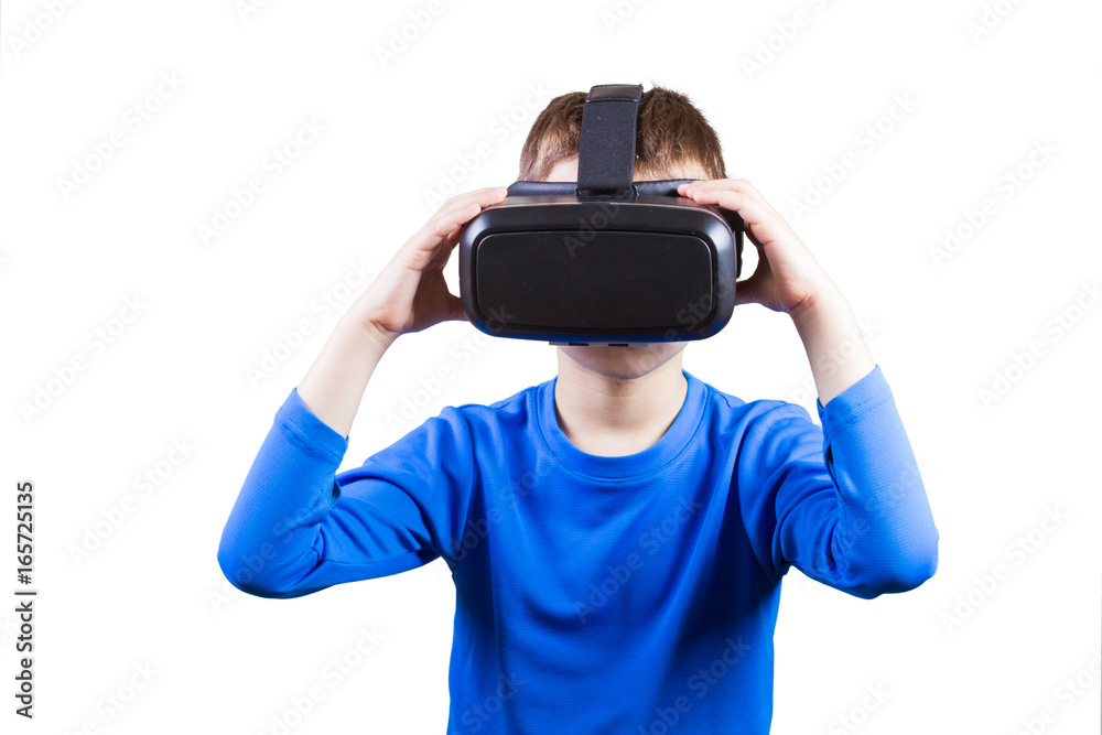 Boy wearing virtual reality glasses watching movies or playing video games, isolated on white background. Boy wearing virtual reality glasses watching movies or playing video games, isolated on white background.