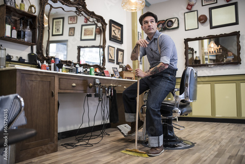 Barber shop, owner posing for pic photo