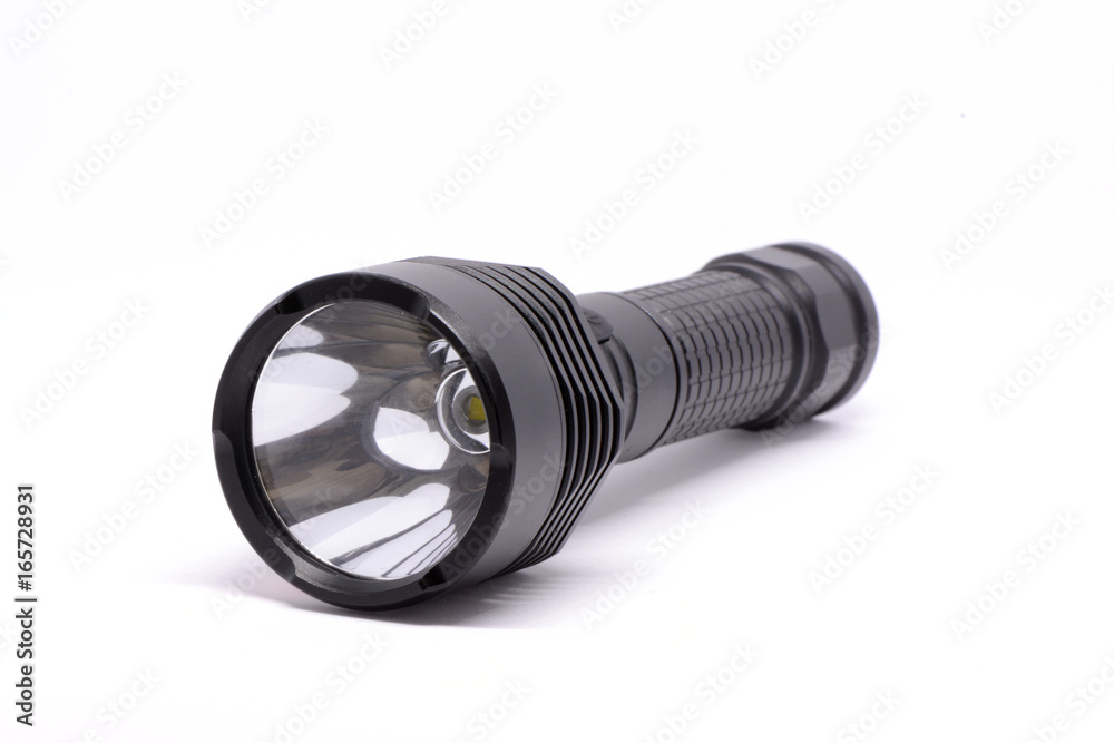Isolated black flashlight on white background Isolated black flashlight on white background