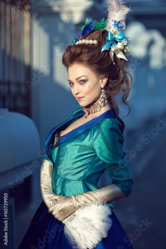 Beautiful caucasian girl dressed in rococo style photo