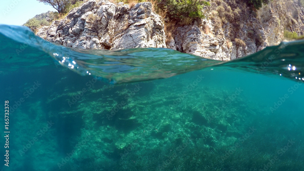 Half underwater close up, background split by waterline, Turkey, Mediterranean Sea,