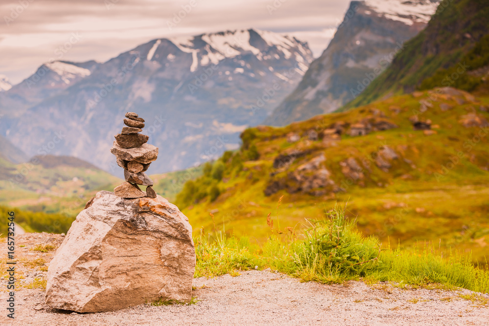 Stone stack and snowy mountain tops, Norway