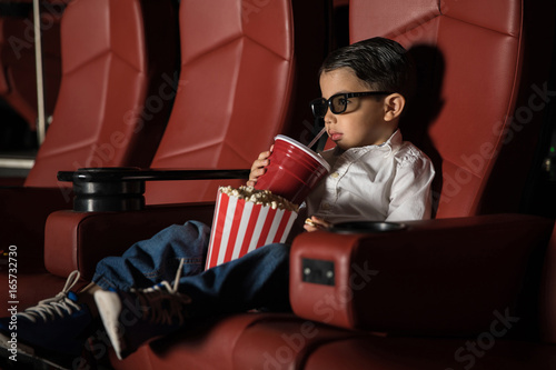 Toddler watching movie at a cinema theater