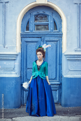 Beautiful caucasian girl dressed in rococo style
