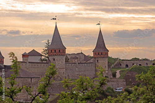 Kamianets-Podilskyi Castle is a former Ruthenian-Lithuanian castle and a later three-part Polish fortress located in the historic city of Kamianets-Podilskyi on the sunset, Ukraine