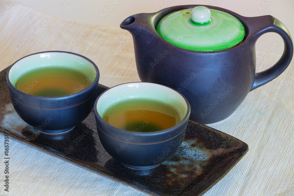 Brewed and healthy Japanese green tea served in traditional hohin and shiboridashi dishes Brewed and healthy Japanese green tea served in traditional hohin and shiboridashi dishes