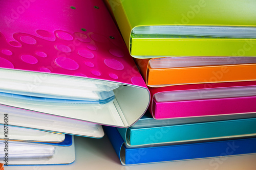 Stacks of office documents and workbooks as a concept of a large amount of work in the office photo