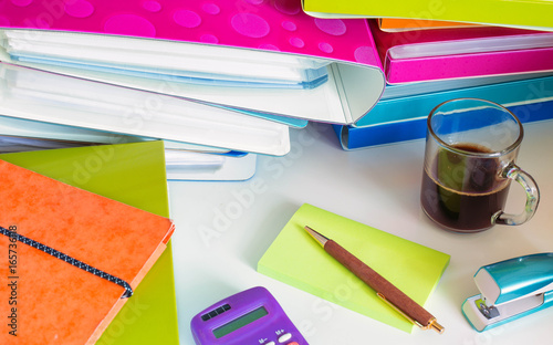 Stacks of office documents and workbooks as a concept of a large amount of work in the office. photo