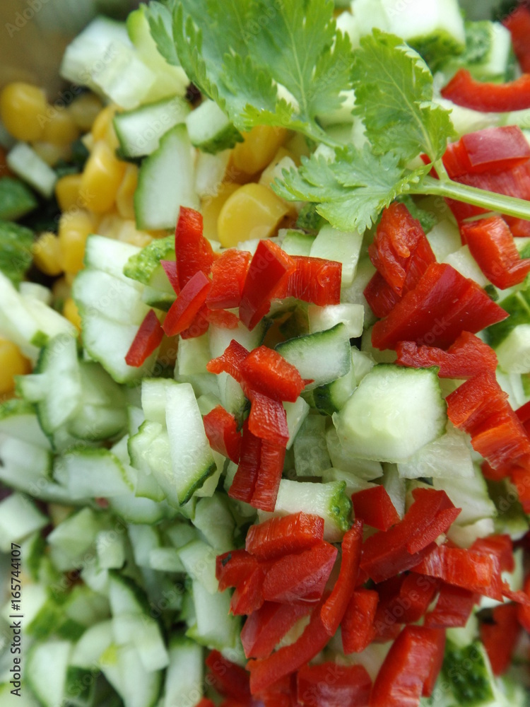 Mexican food. Shredded ingredients for salsa. Cucumbers, corn and chili peppers
Mexican food. Shredded ingredients for salsa. Cucumbers, corn and chili peppers