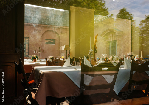 Generic Restaurant table setting view through window in German city of Rastatt  photo