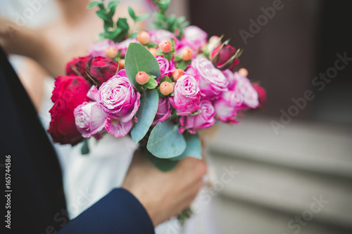 Fototapeta Naklejka Na Ścianę i Meble -  Beautiful luxury wedding bouquet of red flowers