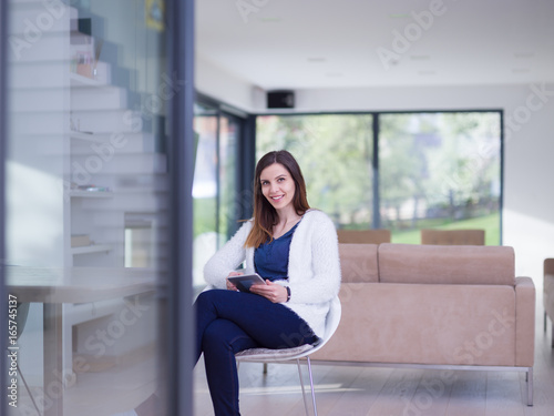 young women using tablet computer by the window Free Download young women using tablet computer by the window - GFXLoad