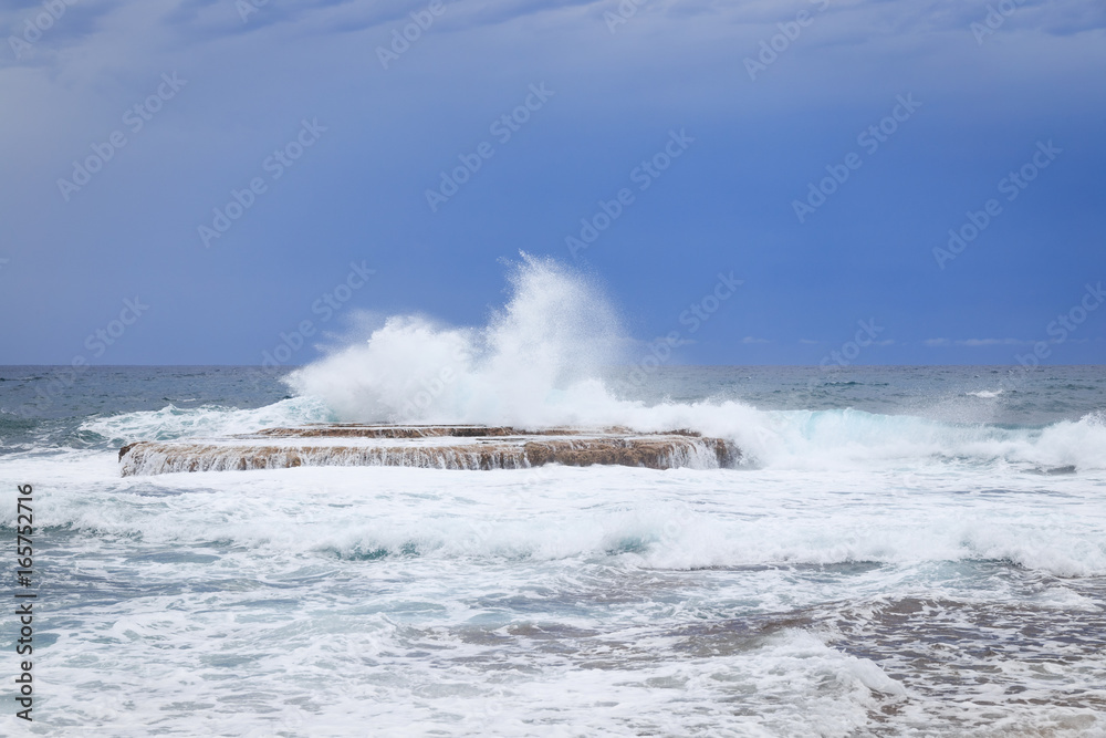 Waves crashing on rock Waves crashing on rock