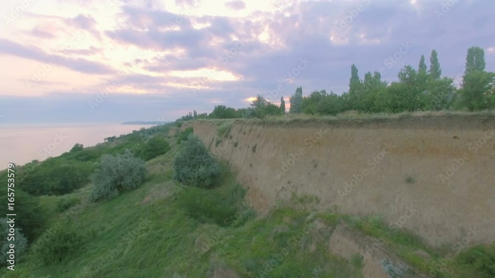 Coastline on Sea. Flight over the sea surface and cliffs Coastline on Sea. Flight over the sea surface and cliffs