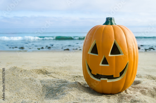 Halloween pumpkin background on the beach