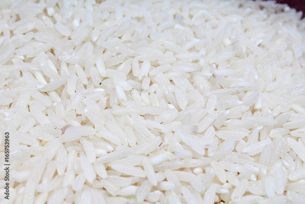 White rice raw rice grains closeup texture studio photo. White rice raw rice grains closeup texture studio photo.