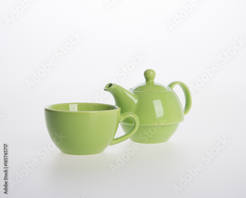 Tea pot set or Porcelain tea pot and cup on background. photo