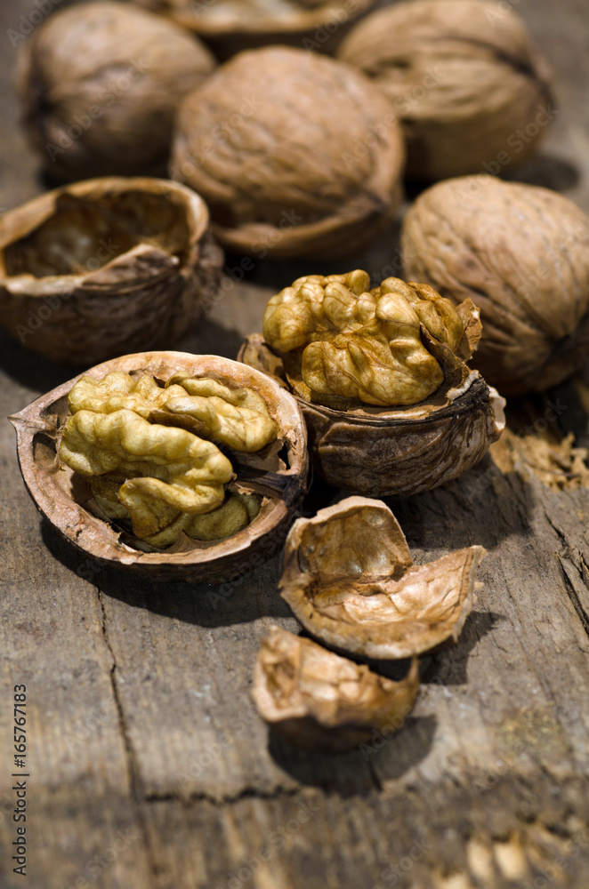 Walnuts on rustic old wooden table Walnuts on rustic old wooden table