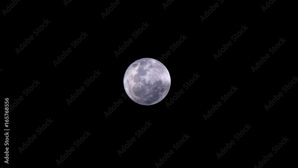 Obraz premium Full Moon or Supermoon / The Full Moon is the moment the entire face of the Moon is illuminated by the Sun's rays. It is the 3rd primary phase