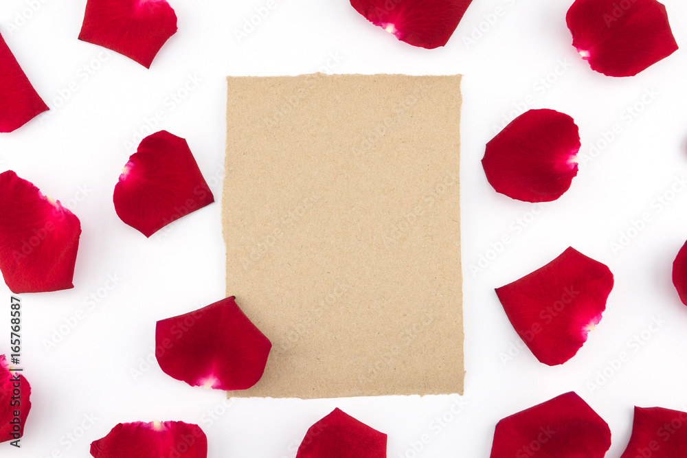 Blank brown card with red rose petals on white background Blank brown card with red rose petals on white background