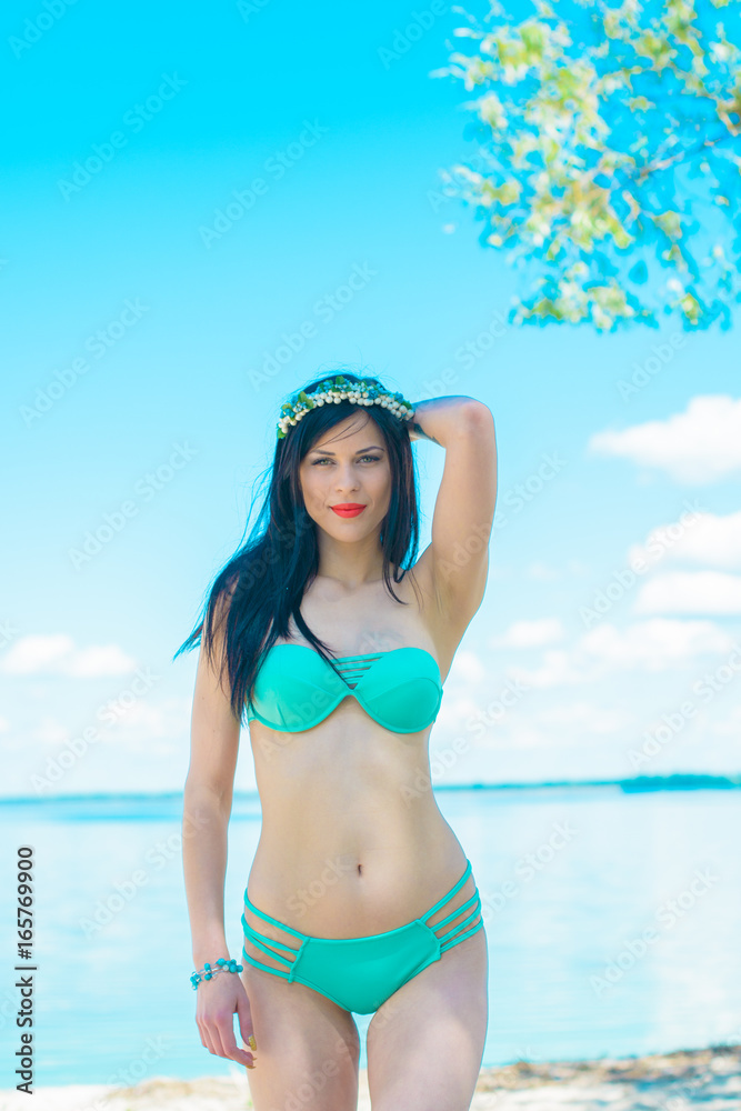 Beautiful young sexy brunette hair stylish woman on vacation near a beach and pleasure the moment, relax and meditation at the sea Beautiful young sexy brunette hair stylish woman on vacation near a beach and pleasure the moment, relax and meditation at the sea