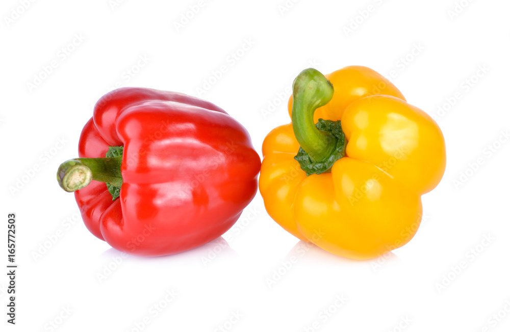 whole fresh yellow and red bell pepper with stem on white background