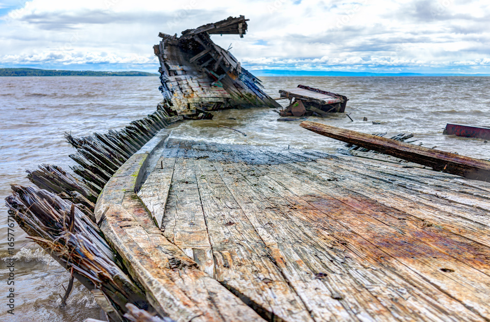 Baie-Saint-Paul in Quebec, Canada shipwreck in water with waves