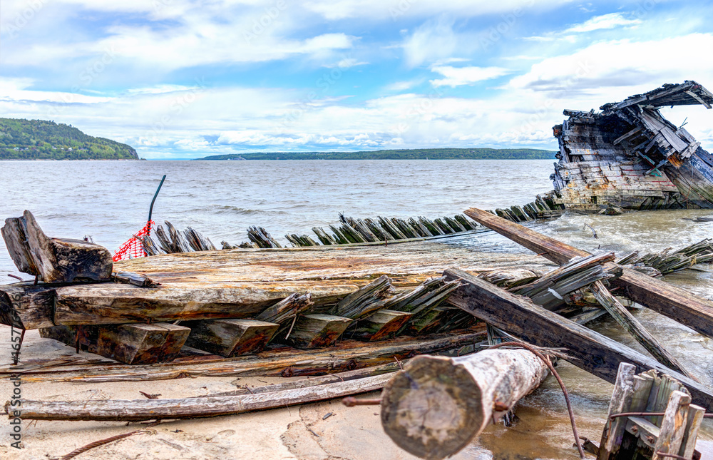 Baie-Saint-Paul in Quebec, Canada shipwreck in water with waves