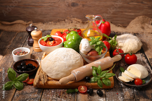 raw dough and pizza ingredient photo