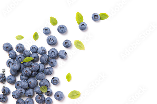 Fresh blueberries and leaves, berry frame isolated on white background, top view