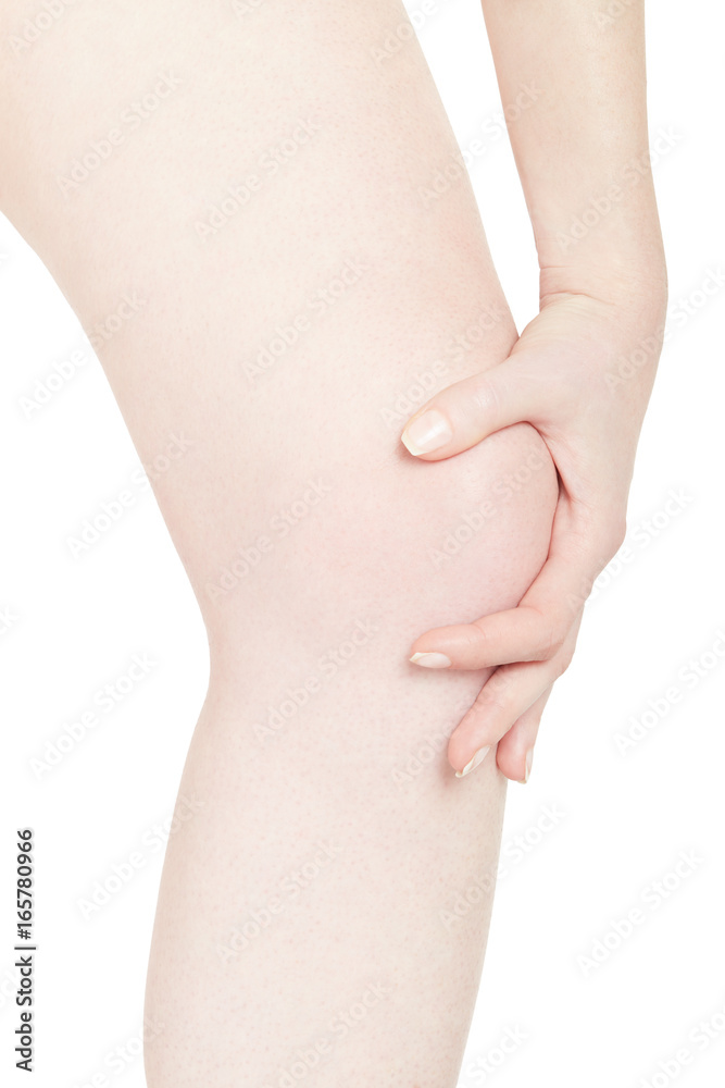 Woman touching her painful kneecap isolated on white, clipping path