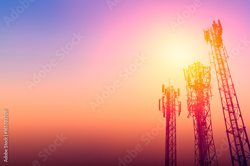 communication tower or 3G network telephone cellsite with dusk sky with space for text