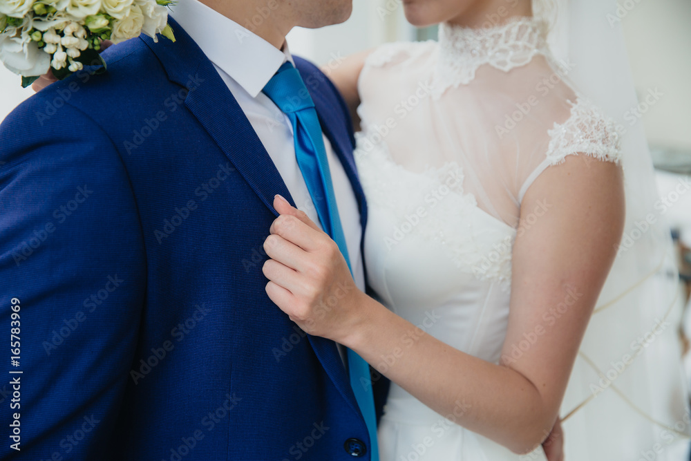 groom and bride are holding hands at wedding day. Concept of love family groom and bride are holding hands at wedding day. Concept of love family