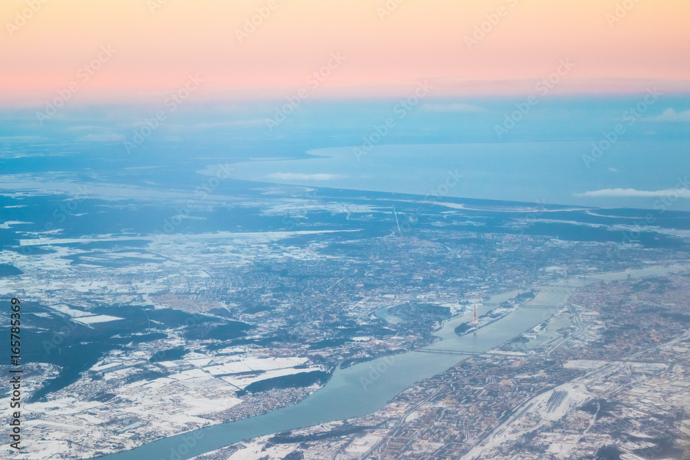 Obraz premium View From Airplane Window on Riga, Latvia. Sunset Sunrise Over Gulf