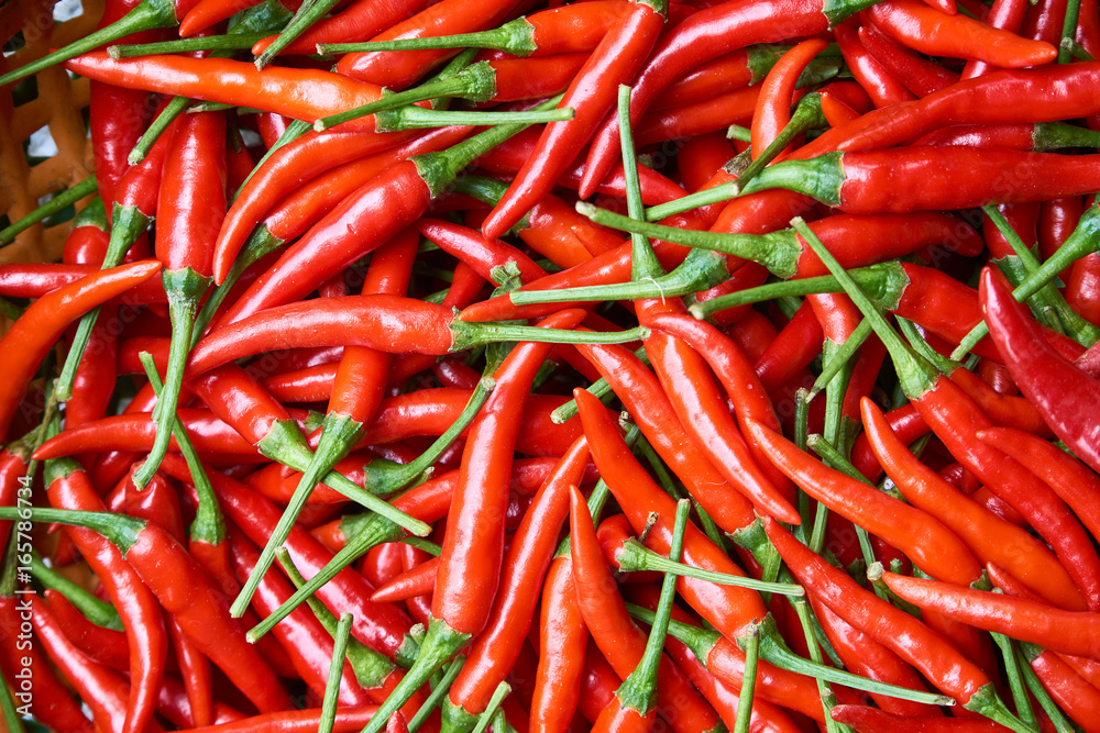 Organic red chili peppers top view - natural pattern or texture. Organic red chili peppers top view - natural pattern or texture.