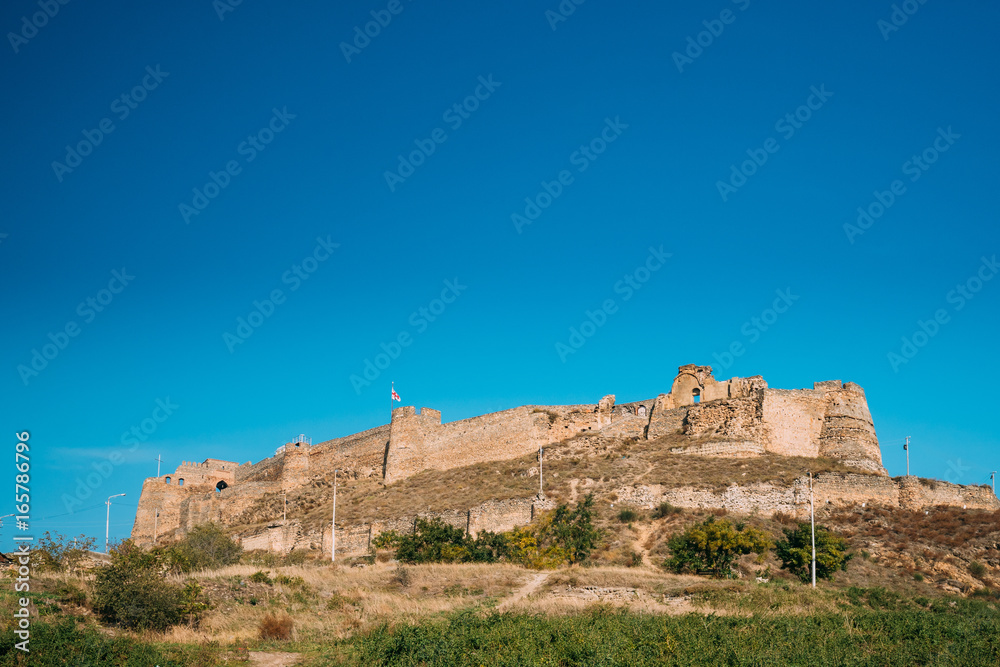 Gori, Shida Kartli Region, Georgia. Gori Fortress Or Goris Tsikhe Is A Medieval Citadel Standing Above The City Of Gori On A Rocky Hill. Sunny Autumn Day