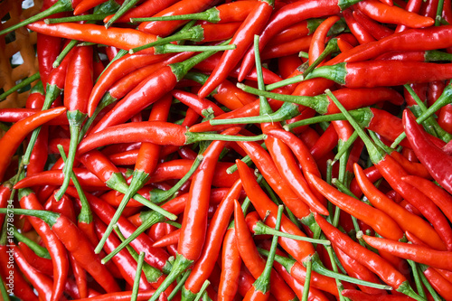 Photo Organic red chili peppers top view - natural pattern or texture.