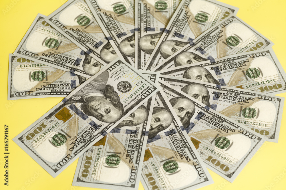 Hundred dollar US bills spread in a circle Hundred dollar US bills spread in a circle