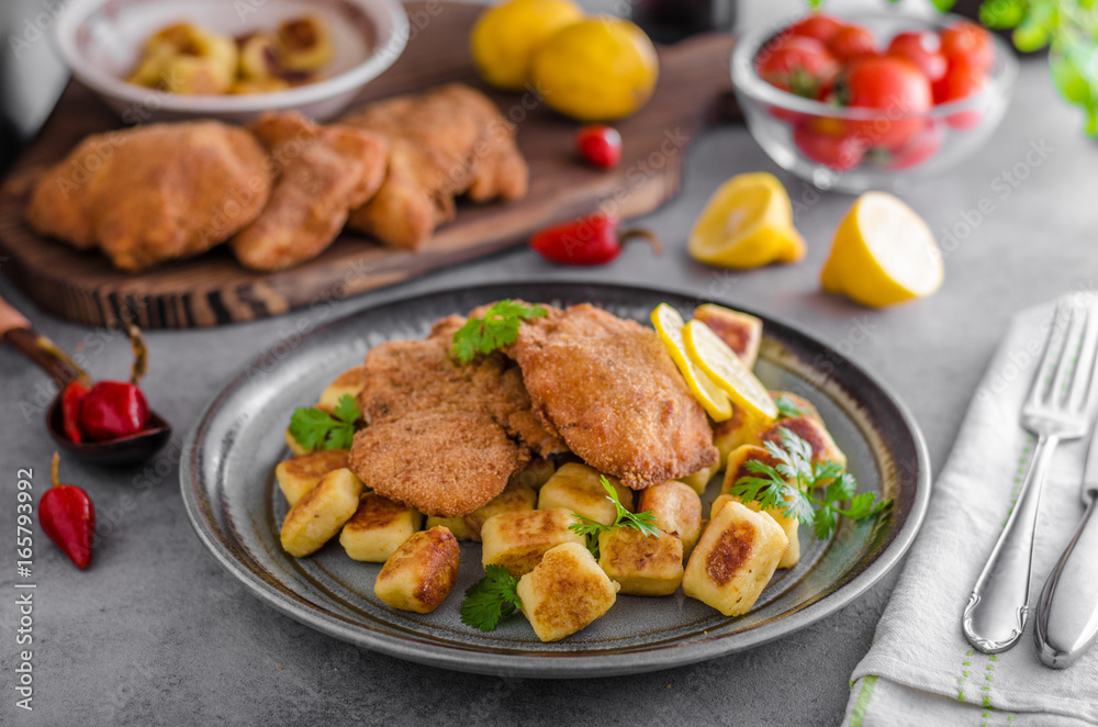 Schnitzel original with lemon and gnocchi fried