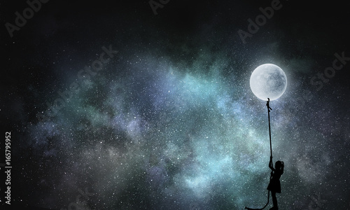 Kid girl catching moon