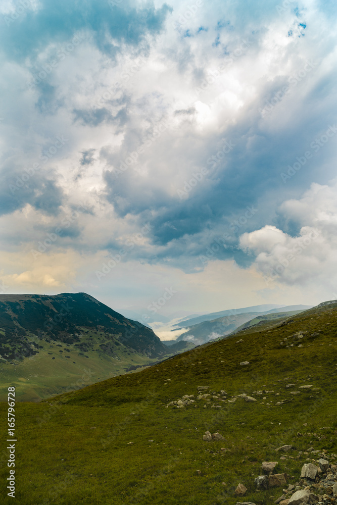 Beautiful mountain scenery with clouds above Beautiful mountain scenery with clouds above