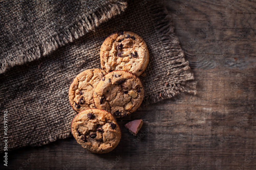 Chocolate chip cookies, freshly baked on rustic wooden table. Selective Focus. Copy space. Chocolate chip cookies, freshly baked on rustic wooden table. Selective Focus. Copy space.