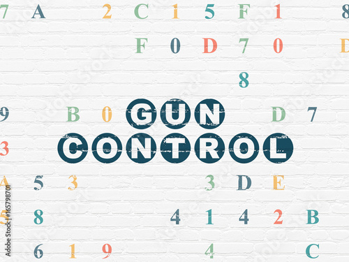Safety concept  Gun Control on wall background