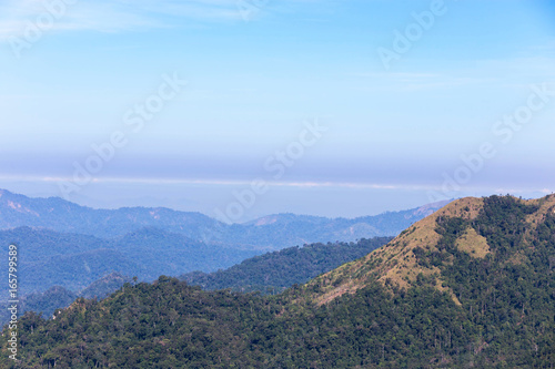  high angle viewpoint over rainforest mountains in Thailand.