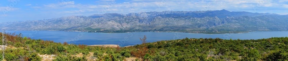 Panorama of Velebit mountains. Sveto Brdo, Vaganski vrh, Paklanica. Seline, Starigrad, Modric. Croatia. View from island Pag.